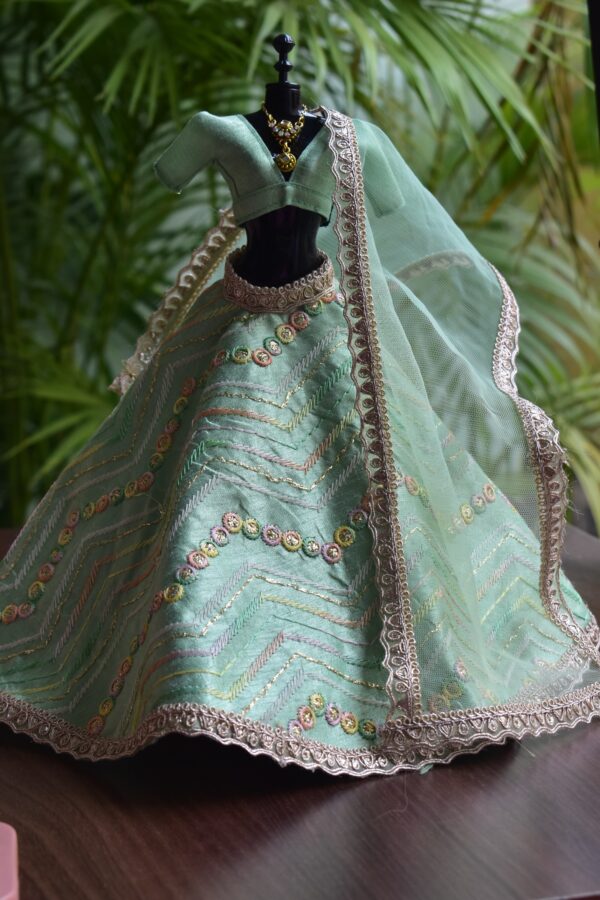 Embroidered pastel green lehenga with accessories for Barbie doll