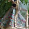 Embellished blue and gold Indian lehenga for Barbie doll