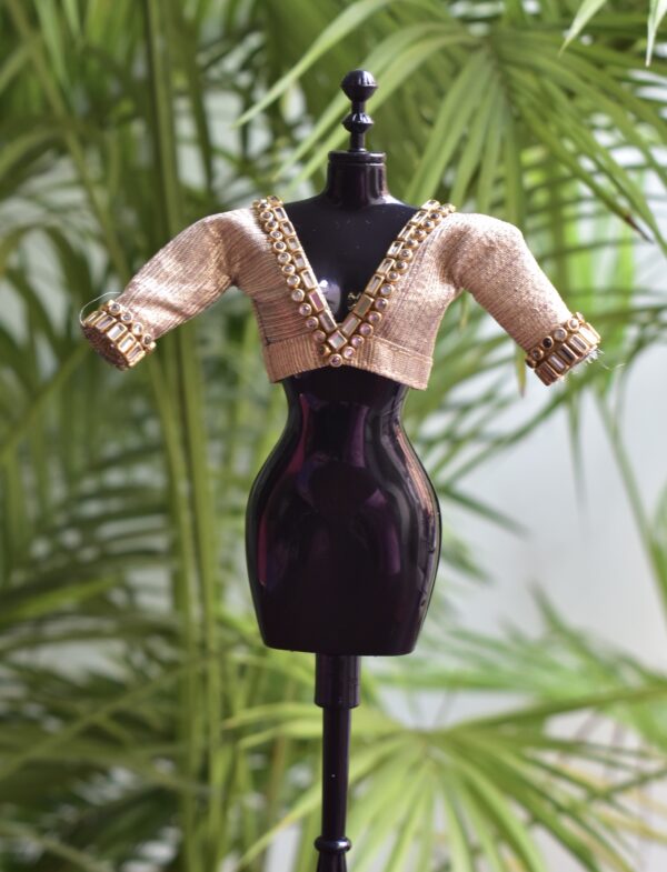 Embellished golden blouse for Barbie doll