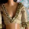 Embellished golden blouse for Barbie doll